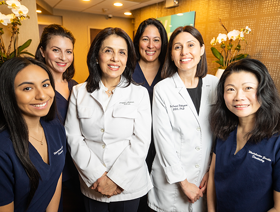 The smiling Port Chester dentists and team members at Westchester Gentle Dentistry smiling