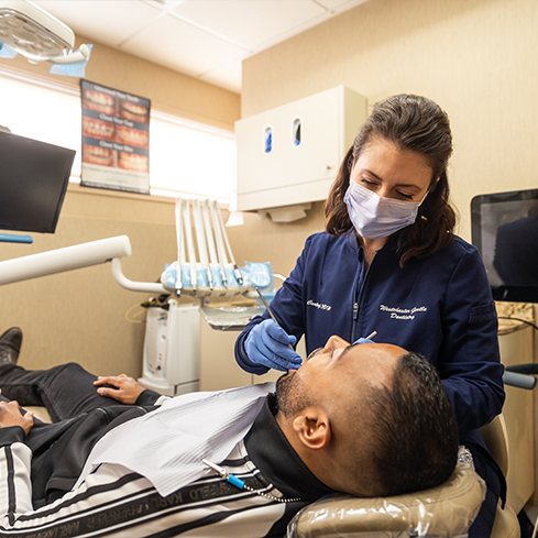 Dentist giving a patient a dental exam