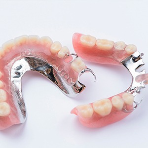 Partial set of dentures with metal clips in foundation