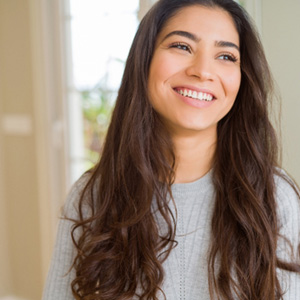 Closeup of woman smiling at home