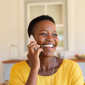 Woman smiling while talking on phone
