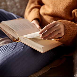 Woman reading a book in her lap