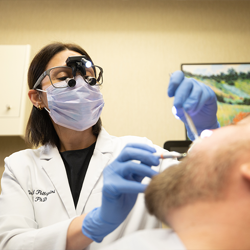 Dentist giving a patient a dental exam